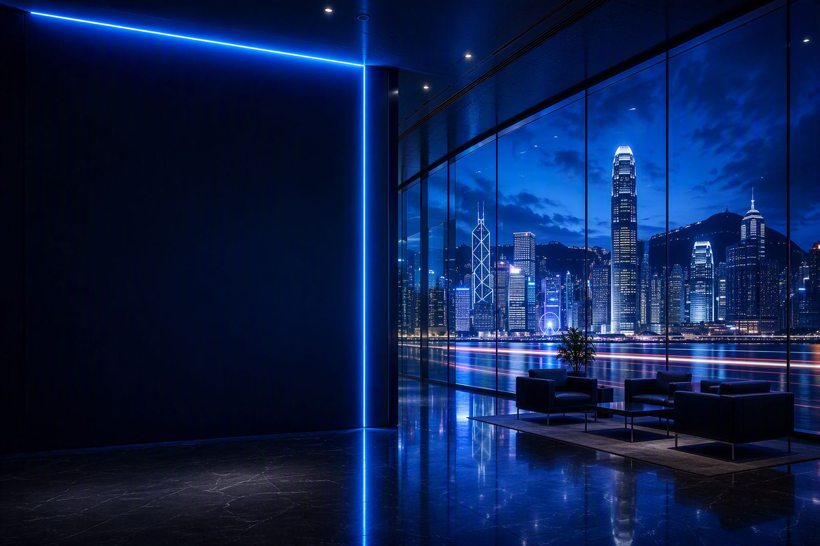 Hong Kong harbour skyline at night viewed through a modern office window